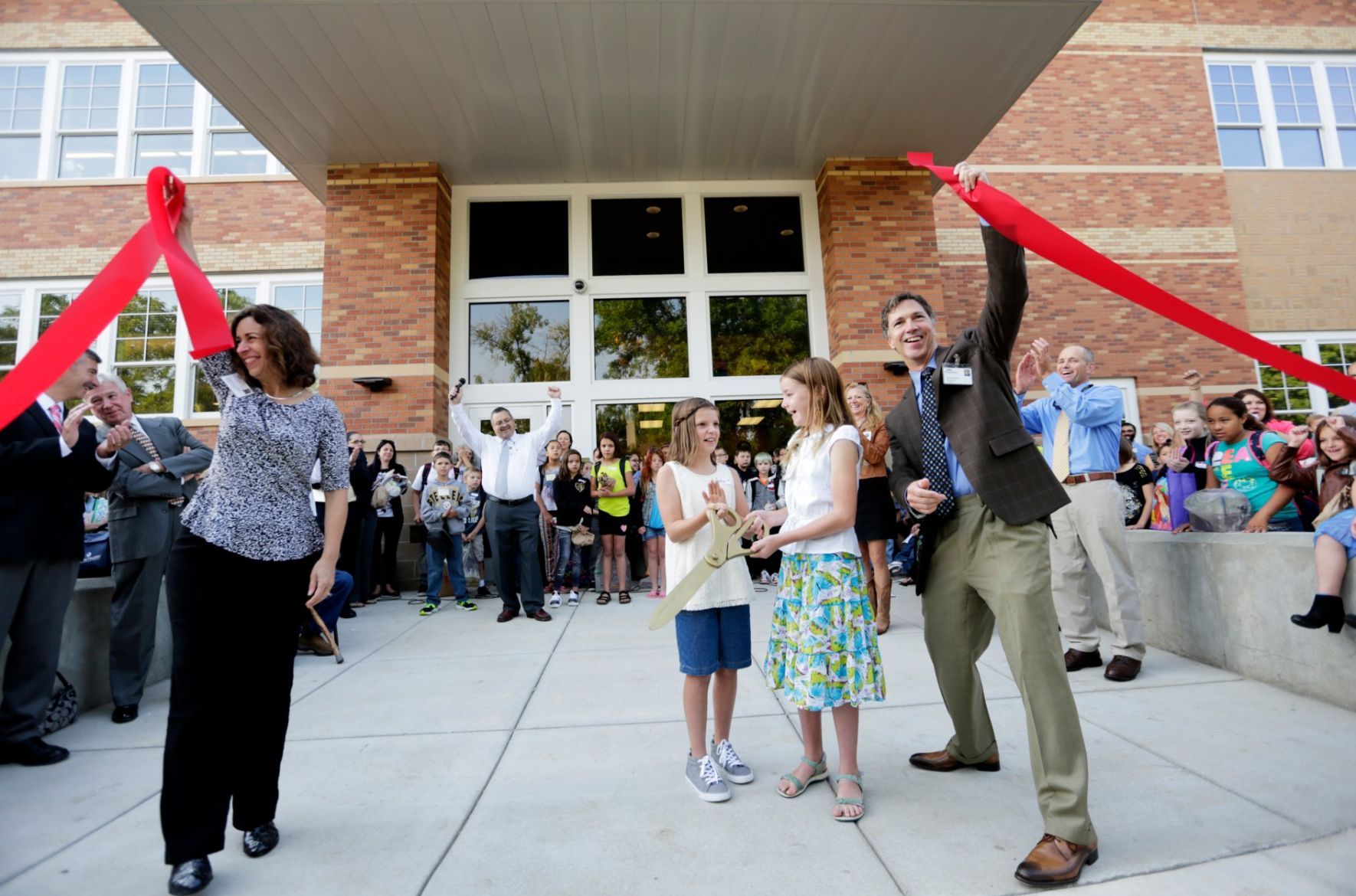 Jim and Heidi Duncan hold up the ribbon